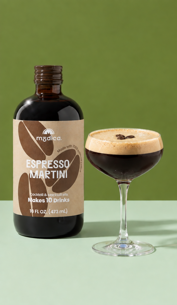 Modica Espresso Martini mixer bottle beside a finished espresso martini