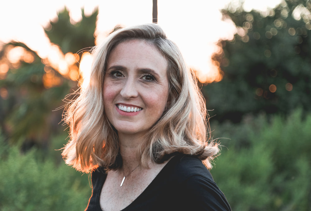 woman smiling about modica superfood cocktail mix