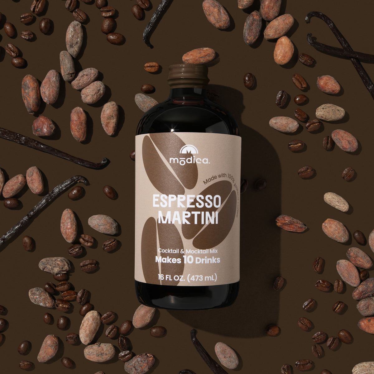 bottle of madeco espresso martini with coffee beans and vanilla beans on a brown background